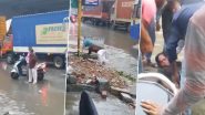 Viral Video: बरसात में पानी से भरी सड़क पार करने के दौरान शख्स का फिसला पैर, बह गया नाले में, देखें वीडियो